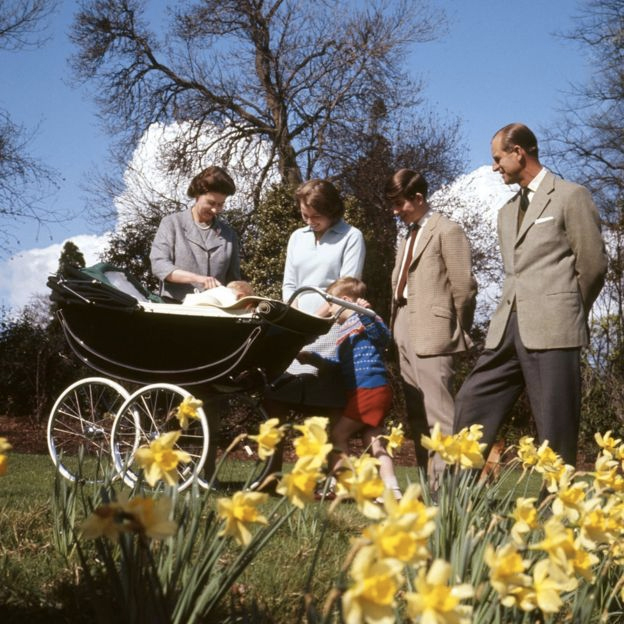 Queen Elizabeth II, baby Prince Edward, Princess Anne, Prince Andrew, Prince Charles and the Duke of Edinburgh, in the gardens of Frogmore House, Windsor, Berkshire, as they celebrate the Queen's 39th birthday. The same pram was used to ferry the Queen's great-granddaughter Princess Charlotte to her christening in July 2015.